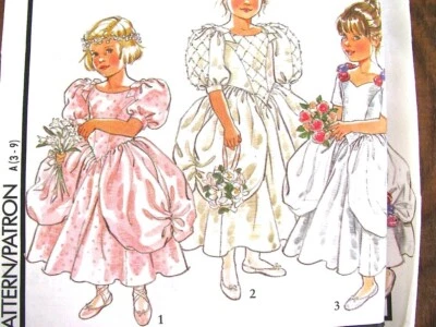 Girls Formal Dresses Sewing Pattern Puff Drape Bridal Style 1889 Size 3-9 Uncut - Image 1 of 4