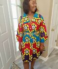 African woman lively colors dress hirt buttons in front.  Size 8,10,12