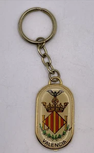 Vintage Valencia Spanien ovaler goldfarbener Rand mit Schild Souvenir Schlüsselanhänger 1,75"x1" - Bild 1 von 8
