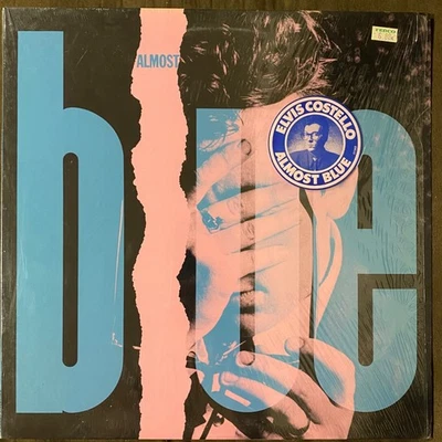 ELVIS COSTELLO & THE ATTRACTIONS Almost - 1981 1st Press Columbia LP - NM SHRINK - Image 1 of 3