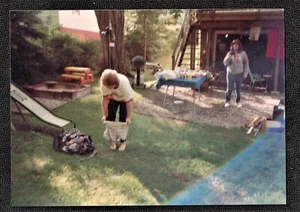 Vintage Photograph Woman in Yard Putting Shorts Over Pants - Woman w/ Camera - Picture 1 of 2