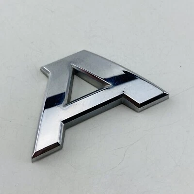 2012-2017 Nissan Versa emblema logotipo símbolo letra emblema porta porta porta porta traseira fabricante de equipamento original E23A - Imagem 1 de 4