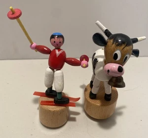 Two Vintage Push Up Toys, Cow With Bell And SCHOWANEK SKIER- Read Description. - Picture 1 of 6