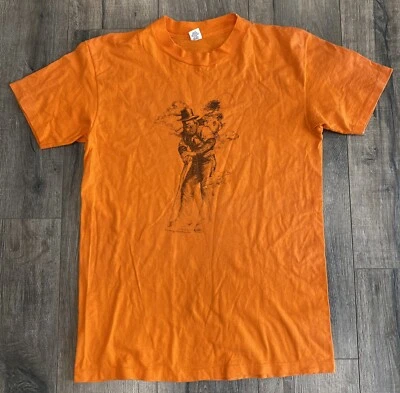 Vintage 1976 Coming Attractions Nick Nicholson Vagabond Hiker Large Orange Shirt - Image 1 of 4