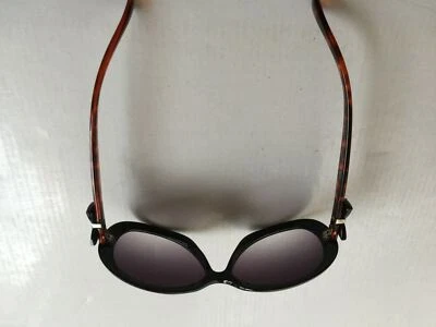 Gafas de sol Foster Grant NS 1211 PR BOW - Marco negro lente púrpura oscuro para dama Foto 1 de 4