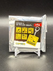 SEALED Resident Evil Biohazard Random Car Sign Keychain New Unopened - Picture 1 of 2