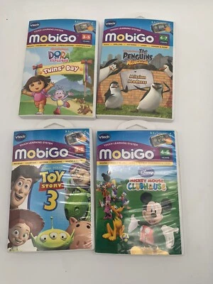 Vtech MobiGo Lot of 4 learning games Dora Penguins Toy Story Mickey Mouse - Image 1 of 4
