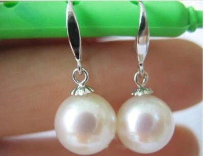 Natural AAAA akoya 7-8mm white round  pearl earrings 14k Gold hook earrings - Image 1 of 2