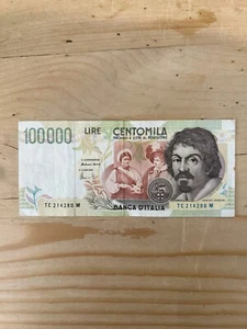 100.000 CENTOMILA LIRE BANCA D'ITALIA BANCONOTA CARAVAGGIO È TIPO TC214280M - Foto 1 di 2