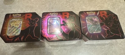 Pokemon TCG: Team Rocket Tin Sellado [Juego de 3] Foto 1 de 3