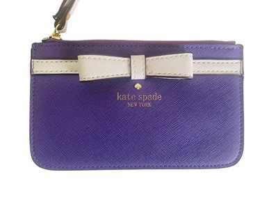 Cartera pulsera Kate Spade New York púrpura lazo blanco Foto 1 de 4