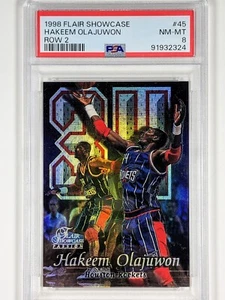HAKEEM OLAJUWON 1998 FLAIR SHOWCASE #45 ROW 2 HOUSTON ROCKETS HOF PSA MINT 8 - Bild 1 von 2