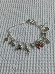 Silver coloured Wizard of Oz Wicked charm bracelet ruby slippers tinman lion - Picture 1 of 1
