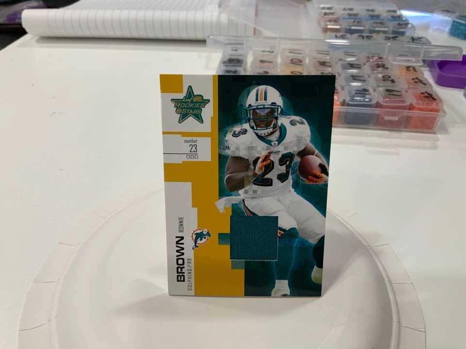 2007 LEAF ROOKIES STARS JERSEY 56 RONNIE BROWN DOLPHINS - Image 1 of 1