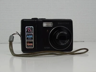 Cámara digital Samsung Digimax S730 7,2 MP negra funciona pero lee defectos  Foto 1 de 4