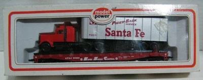 HO Model Power 6950  Santa Fe 50' Flat Car with Tractor And Trailer - Image 1 of 3
