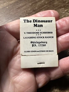 The Dinosaur Man Vintage Matchbook V Theodore Schreiber Shirleysburg PA - Picture 1 of 7