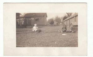 Vtg RPPC Real Photo Postcard BABY sitting alone in Yard with the Chickens! - Picture 1 of 2