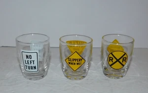 3 NEAT PREOWNED SHOT GLASSES WITH ROAD SIGNS DESIGN - Picture 1 of 4