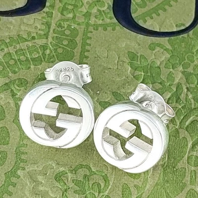 Aretes Gucci entrelazados en G de plata de ley 925 con bolsa Foto 1 de 4