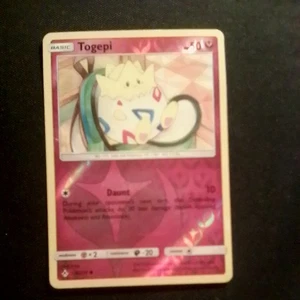 2019 Pokémon Togepi 136/214 Sm-Unbroken Bonds Reverse Holo - Bild 1 von 2