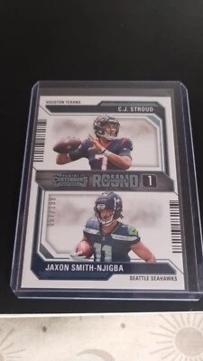 C.J. Stroud & Jaxon Smith-Njigba Blue/199 2023 Panini Contenders Round Number 1  - Image 1 of 2