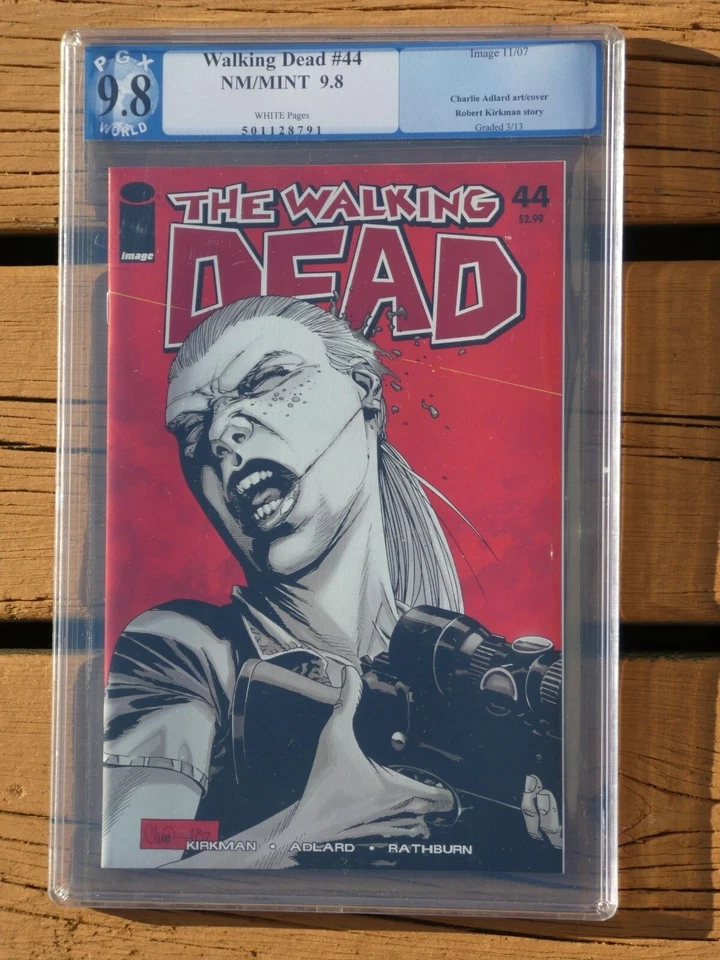 Walking Dead #44 primera impresión PGX 9,8 no CGC Foto 1 de 3