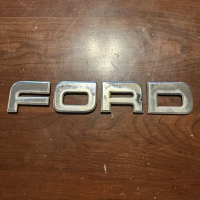 1987-1996 Ford F150 F250 F350 painel de acabamento tampa traseira emblema logotipo manchas fabricante de equipamento original - Imagem 1 de 2