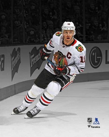 Jonathan Toews Chicago Blackhawks Unsigned White Jersey Skating Spotlight Photo Cover
