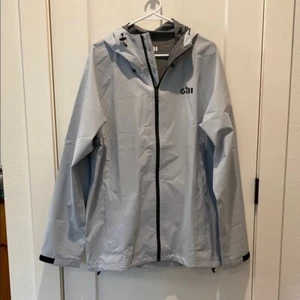 Gill Damen leichte Segeljacke mit Kapuze und durchgehendem Reißverschluss.  Silbergrau.  XL. Neu ohne Etikett - Bild 1 von 9