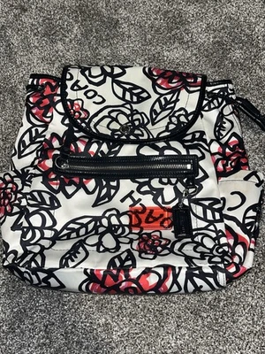 Mochila COACH Amapola Tamaño Mediano Margarita Floral Graffiti Satinado Negro Crema Rosa Foto 1 de 4