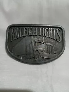 VINTAGE RALEIGH LIGHTS CIGARETTE BELT BUCKLE TRUCKING SEMI - Picture 1 of 4