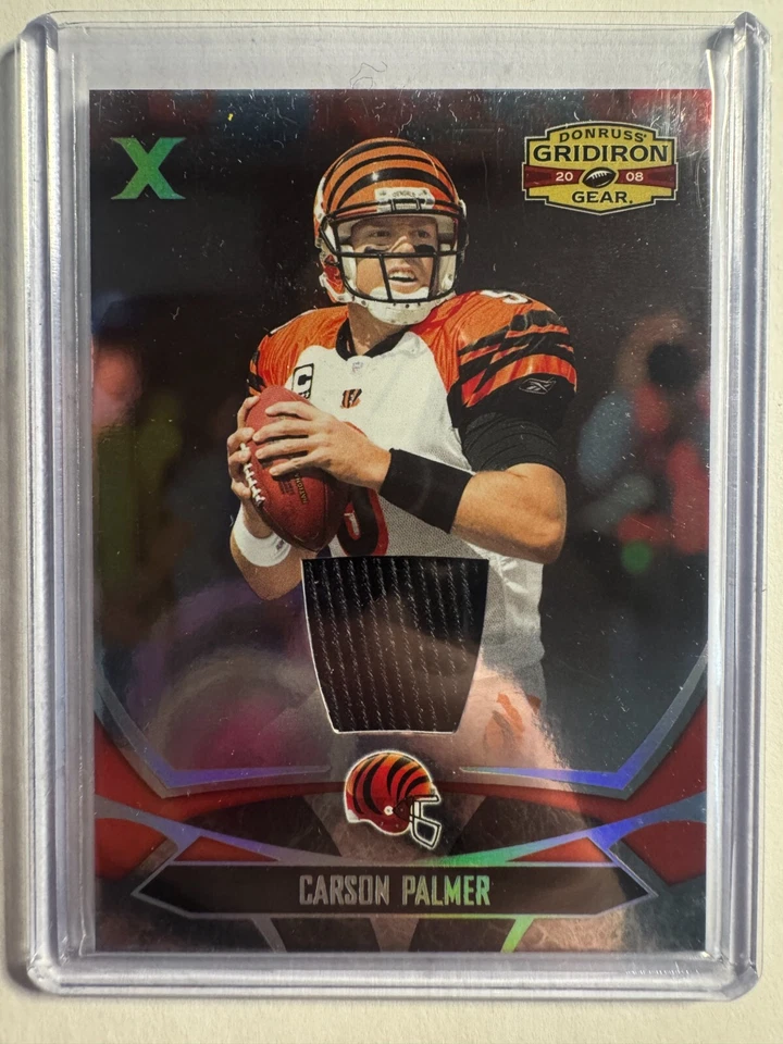 K291,408 - 2008 Donruss Gridiron Gear Jerseys X's #20 Carson Palmer #/100 - Image 1 of 1