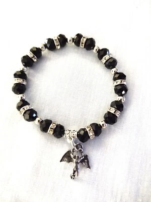 ICARUS CHARM on BLACK CRYSTAL BEADS and RHINESTONE RINGS STRETCH BRACELET 7" - Image 1 of 2