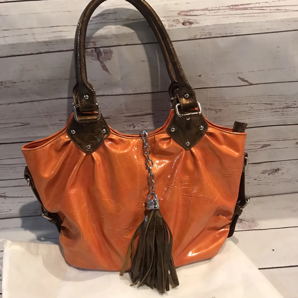 Bolso de mano para mujer cartera naranja bronce borla nuevo sin etiquetas Foto 1 de 4