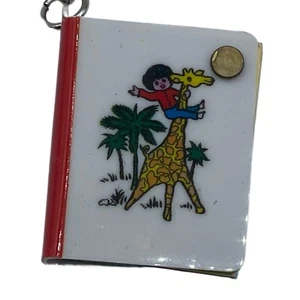 Vintage Sanrio Boy Riding a Giraffe Mini Telephone Book 1 1/2" Keychain - Picture 1 of 5