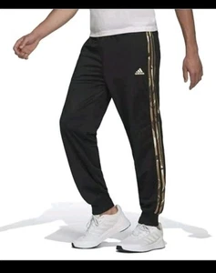 PANTALONES JOGGERS ADIDAS ESSENTIALS 3 RAYAS NEGRO CAMUFLAJE PARA HOMBRE Talla Pequeña - Imagen 1 de 6