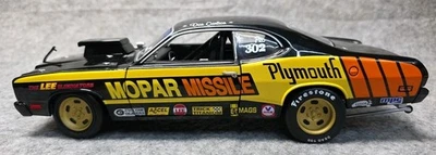 MOPAR CHAMPIONS ERTL 1973 escala 1/18 PLYMOUTH DUSTER ”MISIL MOPAR” Don Carlton Foto 1 de 4