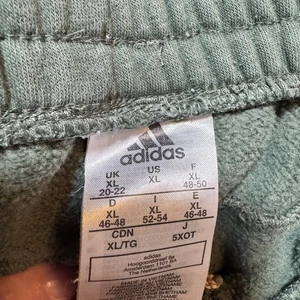 Pantalones de chándal Adidas para hombre XL con puños pantalones de chándal esenciales pierna cónica verde - Imagen 1 de 5