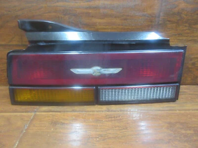 Luz trasera izquierda conductor Cadillac Cimarron, 1984, 1985 Foto 1 de 4