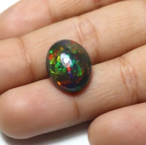 4,9 ct 15 x 11,9 mm natürlicher AAA auffälliger Multi Feuer geräuchter schwarzer äthiopischer Opal oval - Bild 1 von 10