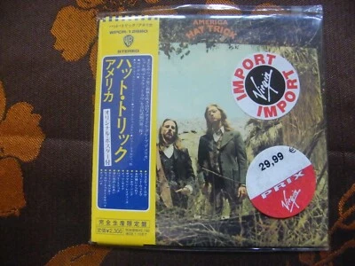 CD AMERICA - Hat Trick / LIMITED EDITION , PAPER SLEEVE JAPAN OBI (2007) NEUF 16 - Photo 1/2