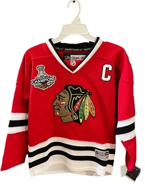 Camiseta Jonathan Toews Chicago Blackhawks NHL #19 Juvenil Talla S/M Reebok Captains Foto 1 de 4