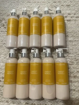 Lote de 100 lociones corporales Clarins Sweet Neroli, 300 ml/cada una Foto 1 de 2