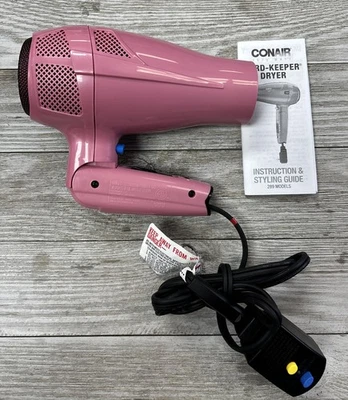 Secador de pelo con cable retráctil rosa Conair ~ caja abierta Foto 1 de 4