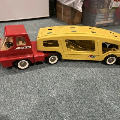 Vintage Structo Pressed Steel Red Turbine Semi Truck Cab  and Yellow car hauler - Image 1 of 4
