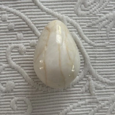 Marble Carved Cream Egg Speckled Easter Décor Paper Weight - Image 1 of 4