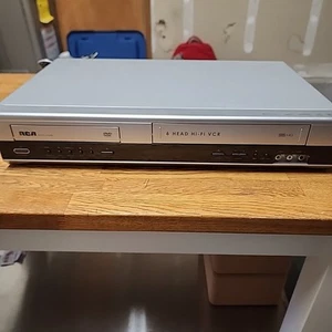 RCA Progressive Scan DVD/Video CD/MP3/Video Cassette Recorder - DRC6350N - Picture 1 of 4