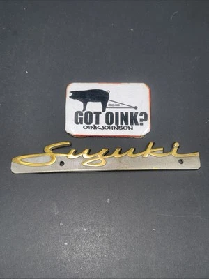 Suzuki 1966-1969 T-250 305 350 500 MK OEM Frame Cover Emblem Badge 68131-11001 - Image 1 of 4