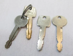 Vintage (2) Sets of Ford Motor Co. Car Keys Round & Square Family of Fine Cars - Picture 1 of 7
